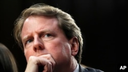 FILE - White House counsel Don McGahn, listens as he attends a confirmation hearing for Supreme Court nominee Brett Kavanaugh before the Senate Judiciary Committee on Capitol Hill in Washington, Sept. 4, 2018. 
