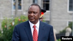 Kenya's President Uhuru Kenyatta prepares to inspect a guard of honor before the opening of the 11th Parliament at the National Assembly Chamber in Nairobi, April 16, 2013.