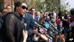 Marvin Gaye's daughter, Nona Gaye, left, talks to the media outside the Los Angeles U.S. District Court after a jury awarded the singer's children nearly $7.4 million after determining singers Robin Thicke and Pharrell Williams copied their father's music to create "Blurred Lines," March 10, 2015.