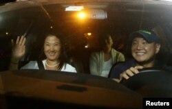 FILE - Keiko, Sachi and Hiro Fujimori, daughters and son of former President Alberto Fujimori arrive to visit their father after Peruvian President Pedro Pablo Kuczynski pardoned him, at Centenario hospital in Lima, Peru, Dec. 24, 2017.