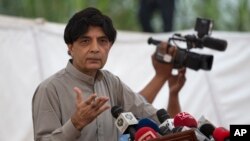 FILE - Pakistani Interior Minister Chaudhry Nisar Ali Khan speaks to reporters in Islamabad, Sept. 23, 2016. He said Thursday that the government was trying to find out who gave "incorrect information" to newsman Cyril Almeida.