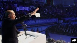 Turkish President Recep Tayyip Erdogan addresses voters in Gaziantep, Turkey, Oct. 24, 2015, in an apparent breach of a law that calls for his neutrality in elections campaigns.