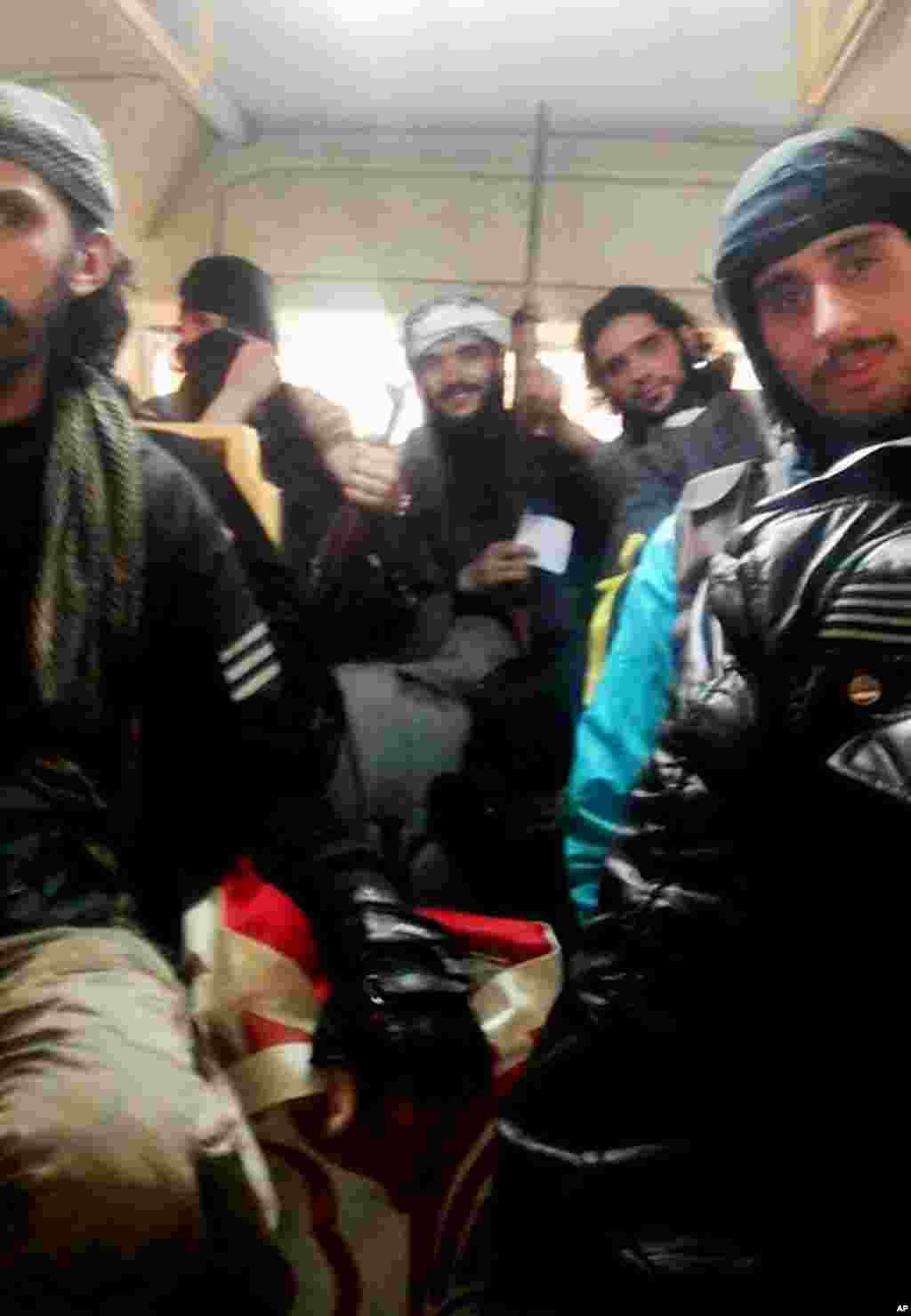 Free Syrian Army fighters on a bus leaving Homs, Syria, May 7, 2014.