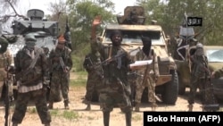 FILE - A screengrab of a video released by the extremist group Boko Haram and obtained by AFP shows group leader Abubakar Shekau. He has described the international response to the coronavirus pandemic as part of a global war on Islam.