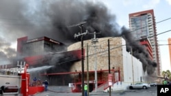 Smoke billows from the Casino Royale in Monterrey, Mexico, Aug. 25, 2011.