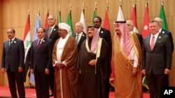 A section of twenty one kings, presidents and top officials from the Arab League summit pose for a group photo, at a gathering near the Dead Sea in Jordan, March 29, 2017. 