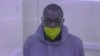  This video grab from an AFPTV video taken on Jan. 21, 2022 in Kampala, shows Kakwenza Rukirabashaija, a prominent Ugandan satirical writer and an outspoken government critic, appearing in court for a bail hearing via a video link from prison.