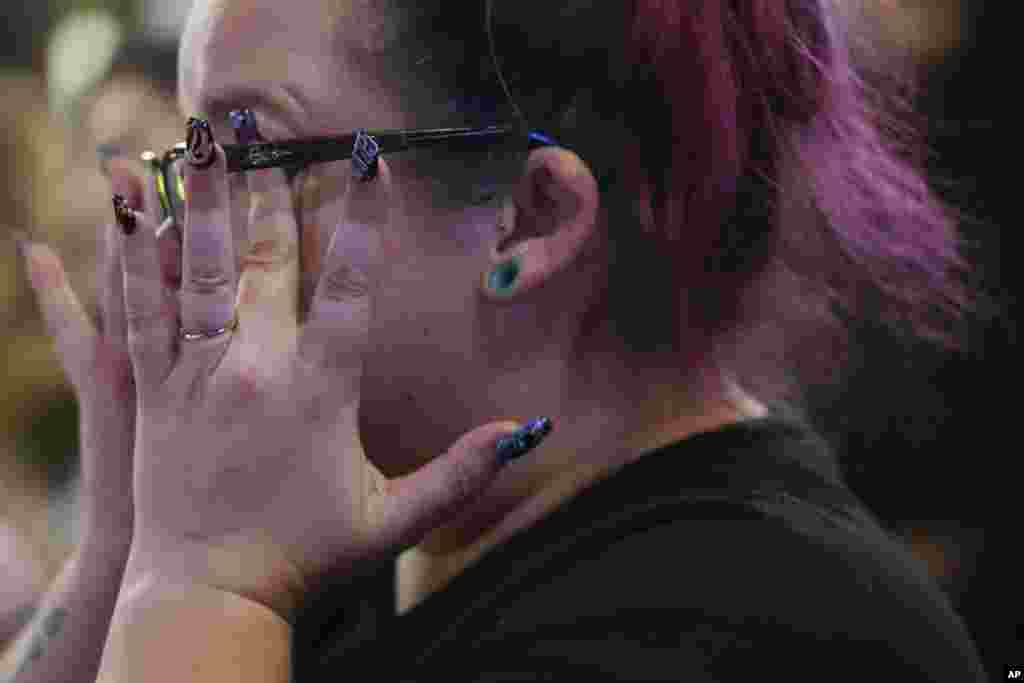 Emmie Reed, center, co-founder of Bans Off Our Bodies Florida collective, wipes away tears after Florida's Amendment 4, which would have enshrined abortion rights in the state, fell short of the 60% vote threshold required to pass, during a watch party for the Yes On 4 campaign, on Election Day, Nov. 5, 2024, in St. Petersburg.