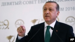 Turkish President Recep Tayyip Erdogan speaks during a meeting on Islam in Eurasia in Istanbul, Oct. 11, 2016. Erdogan says his country, despite objections from Baghdad, is determined to play a role in the liberation of Mosul.