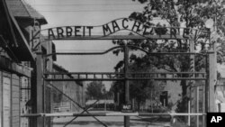 FILE - This undated file image shows the main gate of the Nazi concentration camp Auschwitz I, which was liberated by the Soviets in January 1945. Writing over the gate reads: "Arbeit macht frei" (Work makes you free).