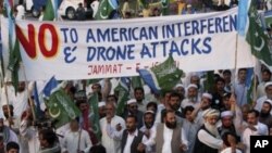 Supporters of a Pakistani religious party Jamaat-e- Islami arrive to join a rally against the U.S. drone strikes in Pakistani tribal areas, in Peshawar, April 23, 2011