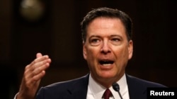 FILE - Former FBI Director James Comey testifies before a Senate Intelligence Committee hearing on Russia's alleged interference in the 2016 U.S. presidential election on Capitol Hill in Washington, June 8, 2017. 