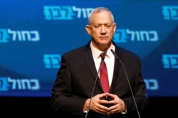 Blue and White party leader Benny Gantz reacts at the party's headquarters following the announcement of exit polls during Israel's parliamentary election in Tel Aviv, Israel, Sept. 18, 2019.