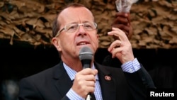 FILE - U.N. special envoy Martin Kobler is seen addressing troops outside Goma in the eastern Democratic Republic of Congo, Aug. 31, 2013. 