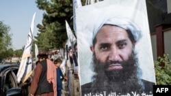 (FILES) A poster of Taliban Supreme Leader Hibatullah Akhundzada is seen along a road in Kabul on August 14, 2023.