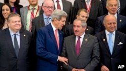 FILE - U.S. Secretary of State John Kerry talks with Jordanian Foreign Minister Nasser Judeh.