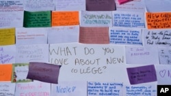 Notes written by students describing what they love about New College of Florida are stuck to a poster during a protest ahead of a meeting of the school's board of trustees, Tuesday, Feb. 28, 2023, in Sarasota, Fla. (AP Photo/Rebecca Blackwell)