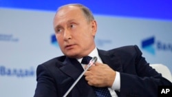 Russian President Vladimir Putin speaks at a meeting of the Valdai International Discussion Club in Sochi, Russia, on Oct. 18, 2018. 