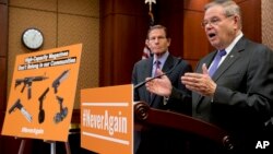 Sen. Bob Menendez, D-N.J., right, accompanied by Sen. Richard Blumenthal, D-Conn., left, speaks at a news conference on an proposed amendment to ban high capacity magazines in guns, on Tuesday, Feb. 12, 2019, in Washington. 