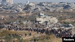 Palestinians, who were displaced to the south at Israel's order during the war, make their way back to their homes in northern Gaza, amid a ceasefire between Israel and Hamas, near Gaza City, Jan. 27, 2025. 