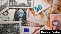 FILE PHOTO: George Washington is seen with printed medical masks on the one Dollar near Euro banknotes in this illustration