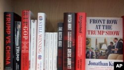Books about Trump and the Trump administration dominate the nonfiction political science shelves at the Bookworm book store in Omaha, Neb., July 8, 2020.