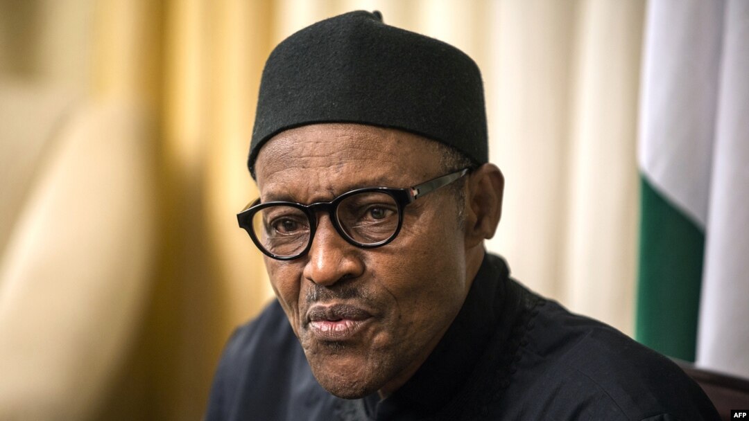 FILE - Nigerian President Muhammadu Buhari gives an interview to Agence France-presse at his hotel during the 25th African Summit, Johannesburg, South Africa, June 14, 2015