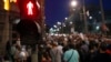 FILE - Journalists gather during a protest organized by the Group for Media Freedom in front of the government headquarters in Belgrade, Serbia, Oct. 16, 2019. The Independent Association of Journalists of Serbia or NUNS has documented 36 attacks on journalists so far this year. 