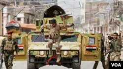 Tentara Irak berpatroli di Baghdad, untuk menjaga keamanan wilayah ini dari bentrokan dengan pengikut Sunni (foto:dok).