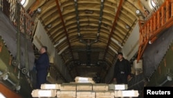 FILE - Boxes of ammunition are seen inside a Russian aircraft at the International Kabul Airport, Afghanistan, Feb. 24, 2016. The head of U.S. Central Command said Oct. 4, 2018, that Moscow was posturing to be a "player in the solution" to the decades-long conflict in Afghanistan.