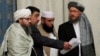 FILE - Members of Taliban delegation take their seats during the multilateral peace talks on Afghanistan in Moscow, Nov. 9, 2018.