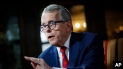 FILE - Ohio Governor Mike DeWine speaks during an interview at the Governor's Residence in Columbus, Ohio, Dec. 13, 2019.