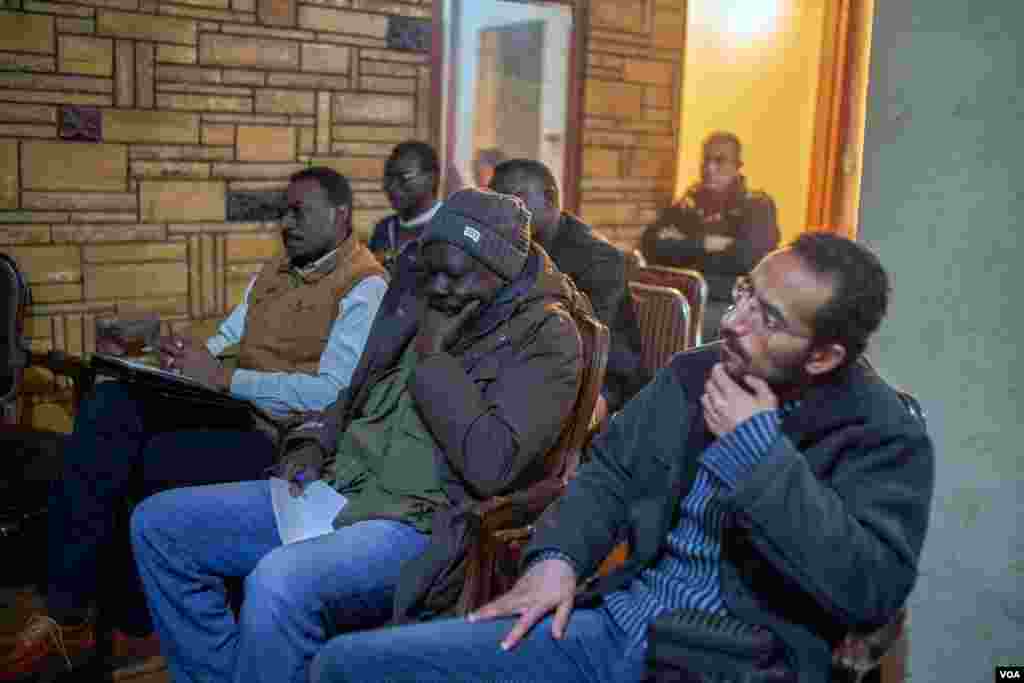 A diverse group of Egyptians and Sudanese attend a conference at Yasser Farag's office in downtown Cairo. (H. Elrasam/VOA)