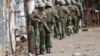 Kenyan police walk during clashes with supporters of opposition leader Raila Odinga, in Kibera slum, Nairobi, Kenya, Aug. 12, 2017. 