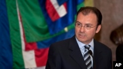 FILE - Then-Mexican Finance Minister Luis Videgaray talks to reporters at the National Palace in Mexico City, Dec. 14, 2012.
