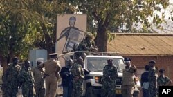 Malawi police patrol on a street of Lilongwe on July 20, 2011