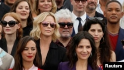 Jury members of the 70th Cannes festival, former Cannes festival award winners, actors and directors pose for a family picture. 