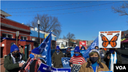 Beneficiarios del TPS y sus familiares marcharon en Washington DC para pedir al gobierno del presidente Joe Biden una solución permanente a su situación. [Foto: VOA/Iacopo Luzi]