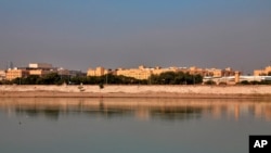 FILE - In this Jan. 3, 2020 file photo, the U.S. Embassy is seen from across the Tigris River in Baghdad, Iraq. Three rockets hit Baghdad on Feb. 22, 2021, with two of them landing in the Green Zone.