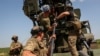 Soldados ucranianos se preparan para disparar un cañón Bohdana 2S22 contra las tropas rusas en una posición cerca de la ciudad de Bájmut, en la región de Donetsk, el 5 de junio de 2023.