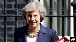 FILE- Britain's Prime Minister Theresa May leaves 10 Downing street in London, July 20, 2016. ﻿