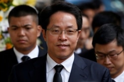 FILE- Zhang Xiaoming, Director of China's Liaison Office in Hong Kong, attends the funeral of Cheng Yu-tung, founder of Hong Kong property group New World Development, in Hong Kong, Oct. 13, 2016.