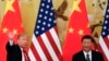 FILE - U.S. President Donald Trump waves next to Chinese President Xi Jinping after attending a joint press conference at the Great Hall of the People in Beijing. 