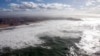 An aerial view shows breaking waves along the ocean beach front in Biarritz on the southern Atlantic Coast of France, Feb. 5, 2014. Global warming is in a temporary hiatus, in part because of heat absorbed deep into the Atlantic and Southern oceans.