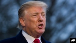 President Donald Trump speaks with the media after stepping off Marine One on the South Lawn of the White House, March 24, 2019, in Washington. 