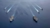 美国海军的尼米兹号和里根号航空母舰组成的双航母战斗群7月6日在南中国海航行。（美国海军提供）