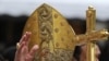 Pope Benedict XVI waves to faithfuls as he arrives to celebrate a mass at San Carlo square in central Turin, 02 May 2010