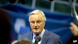 European Union chief Brexit negotiator Michel Barnier speaks with the media as he arrives for a meeting of EU General Affairs ministers, Article 50, at the European Convention Center in Luxembourg, Oct. 15, 2019. 