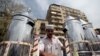 Waleed Ahmed el-Sayed, 31, who received a BA in social services from Assyiut University in 2004, sells juice in Cairo's Tahrir square, May 4, 2012. 