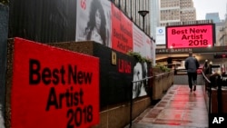 Signs posted around Madison Square Garden promote the return of the Grammy Awards to New York, Jan. 23, 2018, in New York. The Grammy Awards will be held on Sunday.